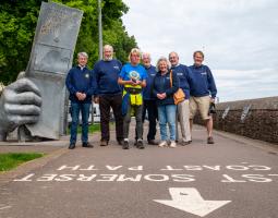 Rachel Goodfellow with members of the Rotary Club of Minehead at the start of the coastal path and run number 44.